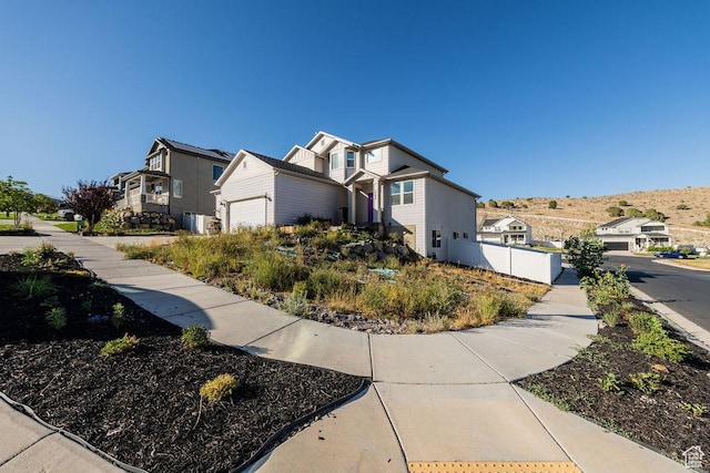7390 N Pawnee Rd, Eagle Mountain, UT 84005 - view of side of home featuring a garage and a residential view