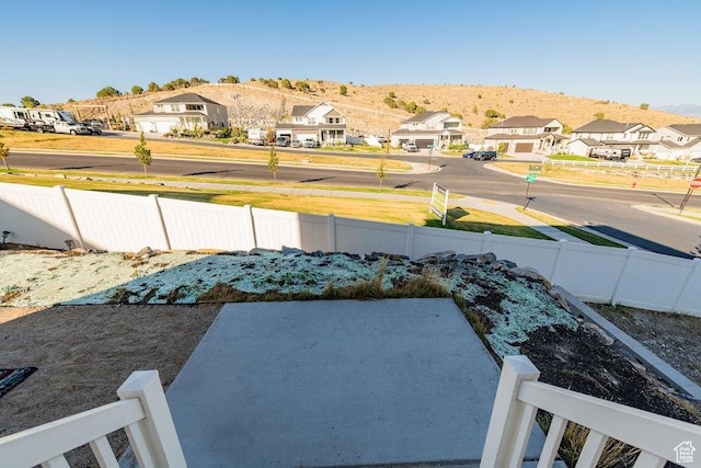 7390 N Pawnee Rd, Eagle Mountain, UT 84005 - view of yard featuring a residential view, a patio area, and a mountain view