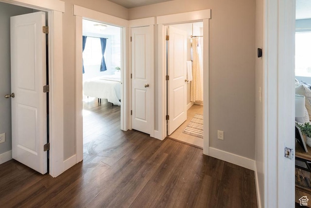 7390 N Pawnee Rd, Eagle Mountain, UT 84005 - hallway featuring dark wood-style floors