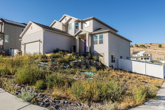 7390 N Pawnee Rd, Eagle Mountain, UT 84005 - view of front of home featuring an attached garage