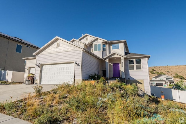 7390 N Pawnee Rd, Eagle Mountain, UT 84005 - craftsman inspired home with an attached garage and driveway