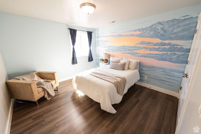 7390 N Pawnee Rd, Eagle Mountain, UT 84005 - bedroom featuring dark wood-type flooring and baseboards