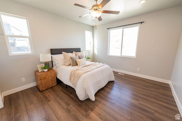 7390 N Pawnee Rd, Eagle Mountain, UT 84005 - bedroom with dark wood-type flooring and ceiling fan