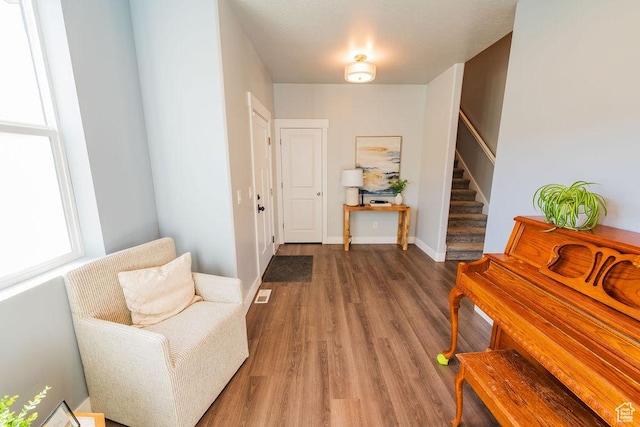 7390 N Pawnee Rd, Eagle Mountain, UT 84005 - entryway with stairs and wood finished floors