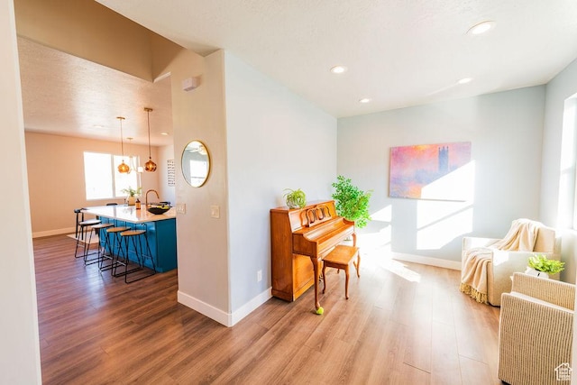 7390 N Pawnee Rd, Eagle Mountain, UT 84005 - living room with light wood-style flooring and recessed lighting