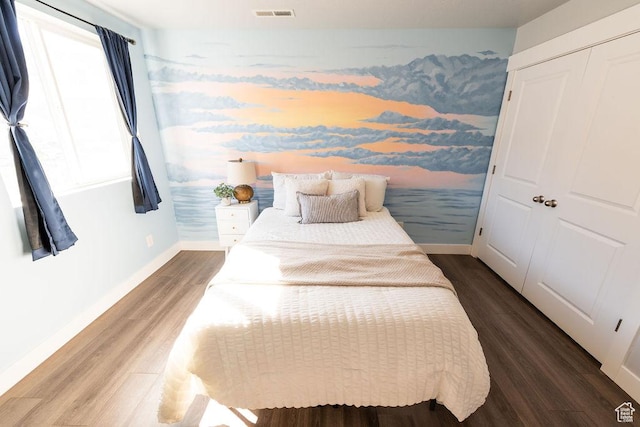 7390 N Pawnee Rd, Eagle Mountain, UT 84005 - bedroom featuring wood finished floors and baseboards