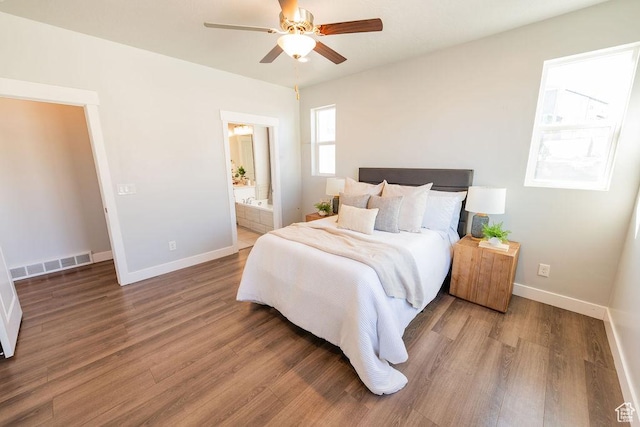 7390 N Pawnee Rd, Eagle Mountain, UT 84005 - bedroom featuring wood finished floors, ensuite bath, and a ceiling fan