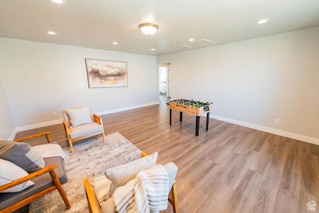 7390 N Pawnee Rd, Eagle Mountain, UT 84005 - living area featuring attic access, light wood-type flooring, and recessed lighting