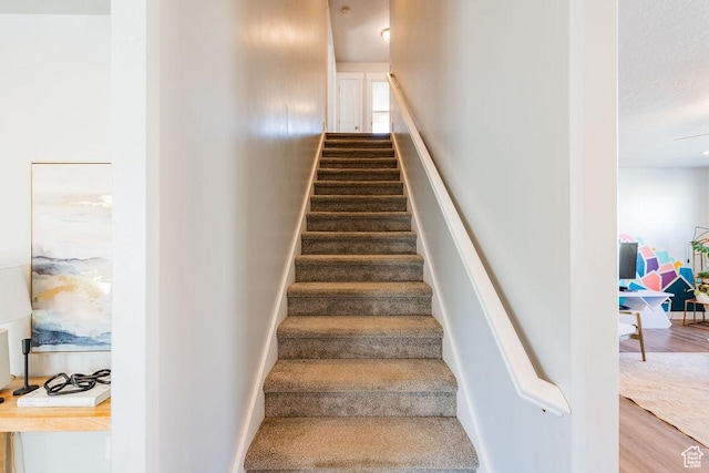 7390 N Pawnee Rd, Eagle Mountain, UT 84005 - stairway featuring wood finished floors
