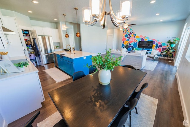 7390 N Pawnee Rd, Eagle Mountain, UT 84005 - dining area with recessed lighting, dark wood-style floors, a chandelier, and a ceiling fan
