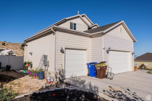 7390 N Pawnee Rd, Eagle Mountain, UT 84005 - garage featuring driveway