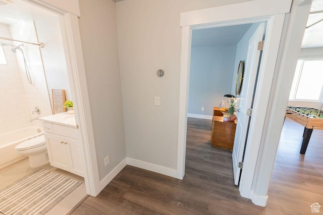 7390 N Pawnee Rd, Eagle Mountain, UT 84005 - bathroom featuring wood finished floors, vanity, and shower / bathtub combination
