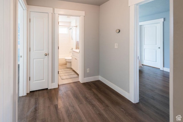 7390 N Pawnee Rd, Eagle Mountain, UT 84005 - unfurnished bedroom featuring dark wood-style floors and ensuite bath