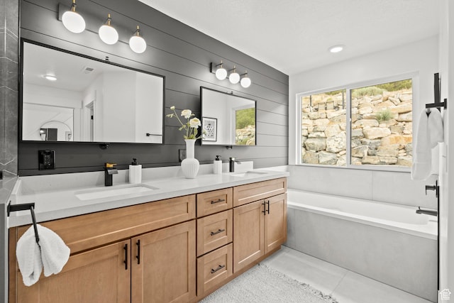 3873 E S Pass Cv, Eagle Mountain, UT 84005 - bathroom with double vanity, a bath, and tile patterned flooring