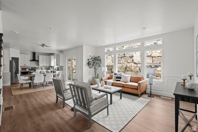 3873 E S Pass Cv, Eagle Mountain, UT 84005 - living room with light wood-style floors