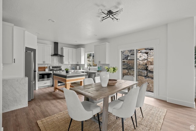 3873 E S Pass Cv, Eagle Mountain, UT 84005 - dining room with light wood-style floors