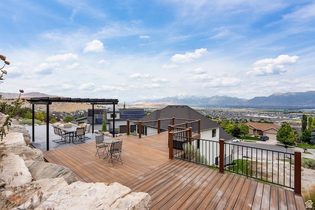 3873 E S Pass Cv, Eagle Mountain, UT 84005 - wooden deck with a mountain view, a pergola, and outdoor dining area