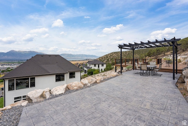 3873 E S Pass Cv, Eagle Mountain, UT 84005 - view of patio featuring a mountain view, a pergola, and outdoor dining space