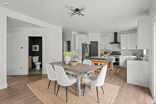 3873 E S Pass Cv, Eagle Mountain, UT 84005 - dining room featuring light wood finished floors and baseboards