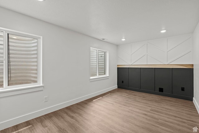 3873 E S Pass Cv, Eagle Mountain, UT 84005 - spare room featuring wood finished floors and recessed lighting