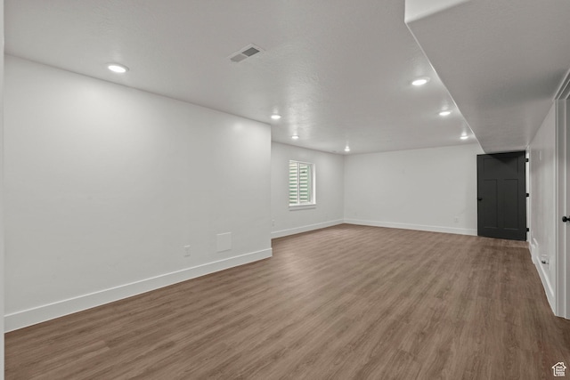 3873 E S Pass Cv, Eagle Mountain, UT 84005 - empty room with wood finished floors and recessed lighting