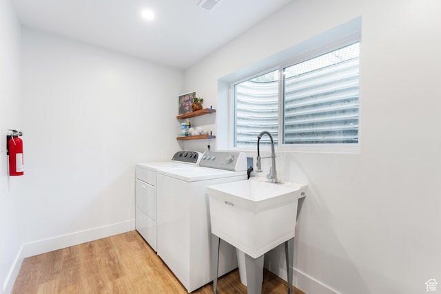 4974 W Diamondback Dr, Riverton, UT 84096 - laundry room with washer and dryer and light wood-style floors