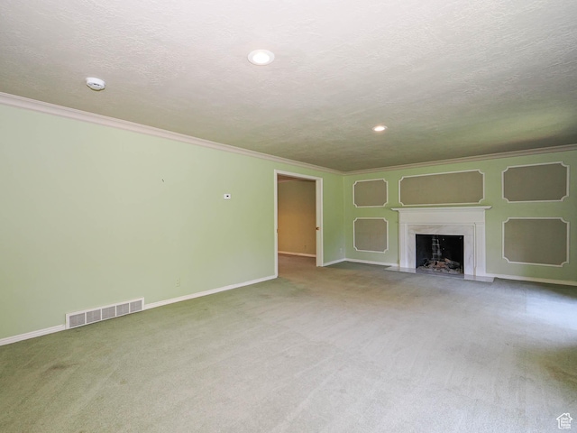 4893 S Regency St, Holladay, UT 84117 - unfurnished living room with carpet flooring, a fireplace with flush hearth, crown molding, a textured ceiling, and recessed lighting
