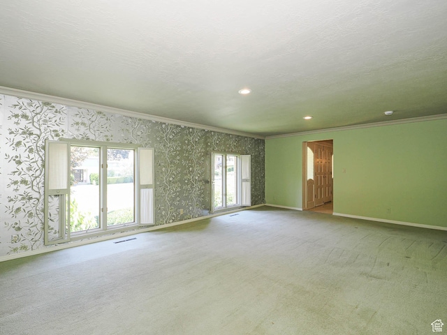 4893 S Regency St, Holladay, UT 84117 - spare room featuring wallpapered walls, crown molding, carpet flooring, and recessed lighting