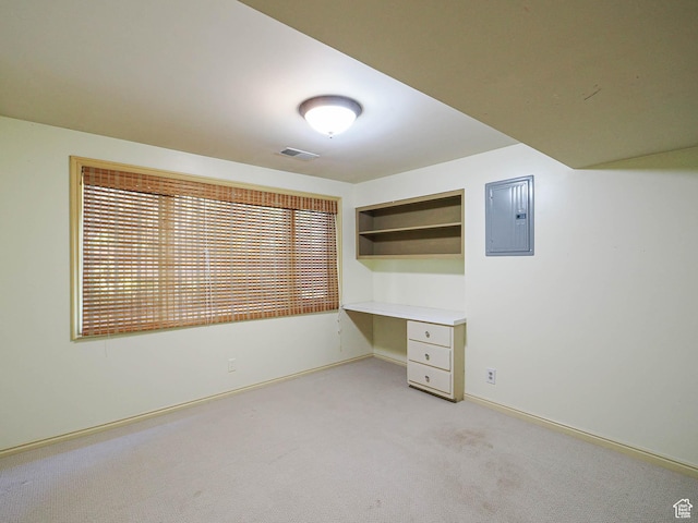 4893 S Regency St, Holladay, UT 84117 - unfurnished office featuring built in study area, electric panel, and light carpet