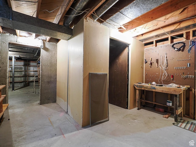 4893 S Regency St, Holladay, UT 84117 - unfinished basement featuring a workshop area
