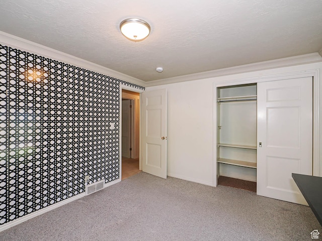 4893 S Regency St, Holladay, UT 84117 - unfurnished bedroom with carpet, a textured ceiling, crown molding, and a closet