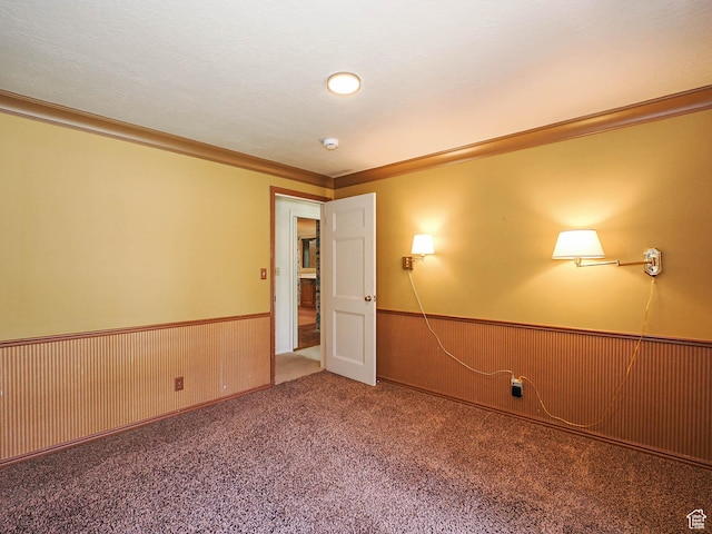 4893 S Regency St, Holladay, UT 84117 - carpeted empty room with a wainscoted wall, ornamental molding, wood walls, and a smoke detector