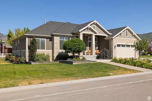 13571 S Meadow Heights Ln, Draper, UT 84020 - craftsman inspired home with stone siding, a front yard, and a garage