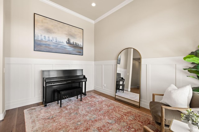 13571 S Meadow Heights Ln, Draper, UT 84020 - living area with crown molding, a decorative wall, wood finished floors, wainscoting, and arched walkways