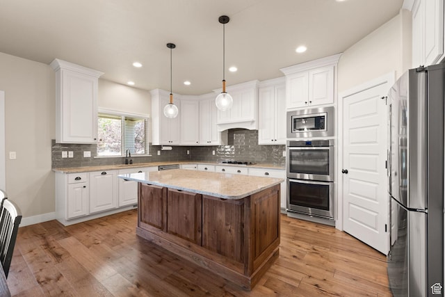 13571 S Meadow Heights Ln, Draper, UT 84020 - kitchen featuring stainless steel appliances, tasteful backsplash, white cabinets, a kitchen island, and recessed lighting