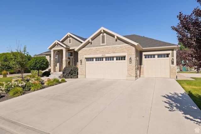 13571 S Meadow Heights Ln, Draper, UT 84020 - craftsman-style home with stone siding, a garage, and driveway