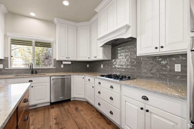 13571 S Meadow Heights Ln, Draper, UT 84020 - kitchen with stainless steel appliances, dark wood-style floors, white cabinets, tasteful backsplash, and recessed lighting