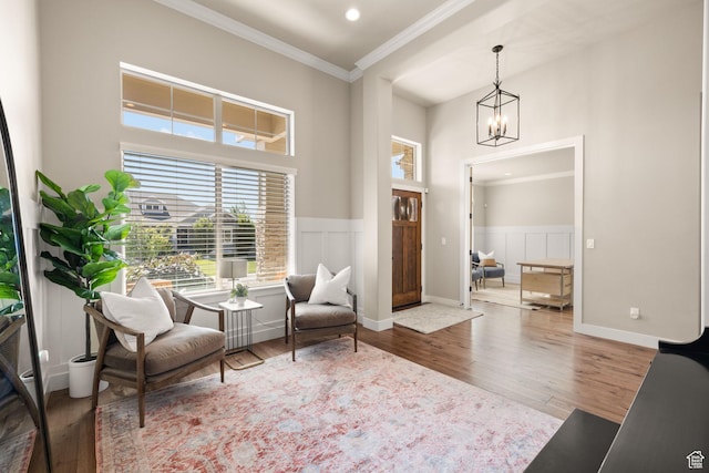 13571 S Meadow Heights Ln, Draper, UT 84020 - sitting room featuring crown molding, wood finished floors, a chandelier, wainscoting, and recessed lighting