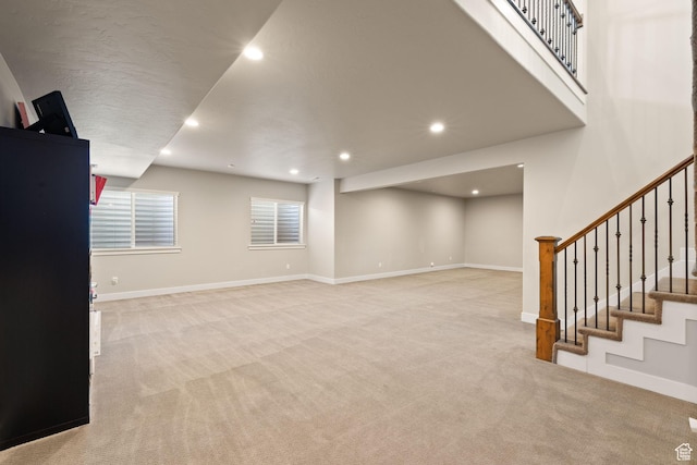 13571 S Meadow Heights Ln, Draper, UT 84020 - unfurnished living room featuring light colored carpet, stairway, and recessed lighting