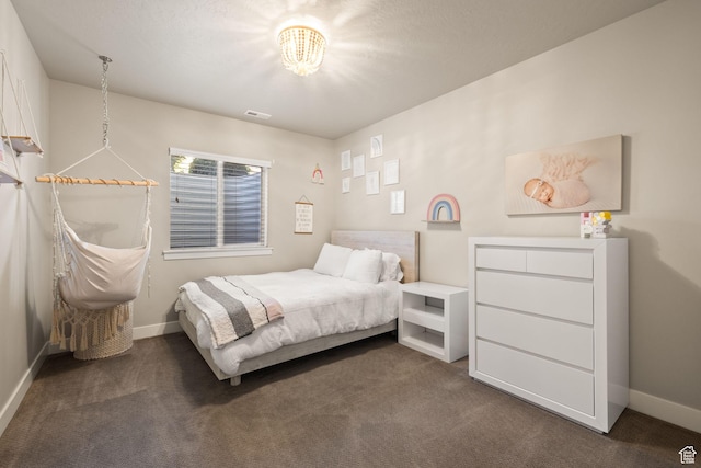 13571 S Meadow Heights Ln, Draper, UT 84020 - bedroom featuring dark carpet and a chandelier