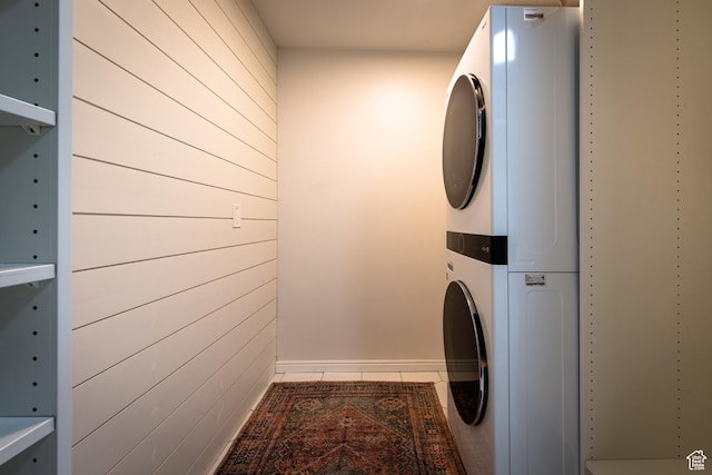 552 E Sunset Stream Way, Draper, UT 84020 - washroom with stacked washer and clothes dryer, wooden walls, and tile patterned flooring