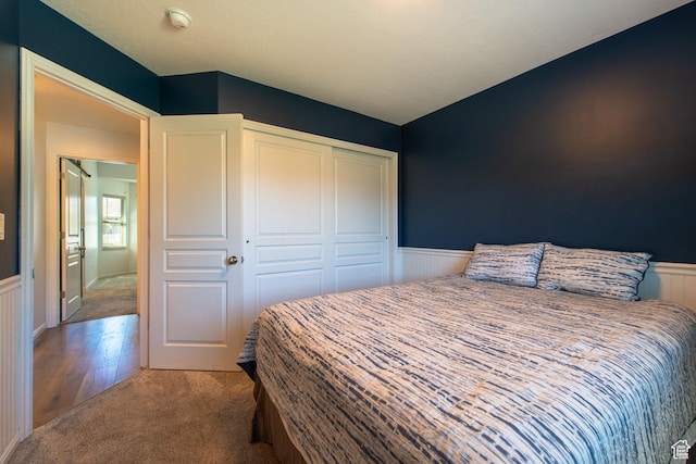 552 E Sunset Stream Way, Draper, UT 84020 - carpeted bedroom featuring a wainscoted wall and a closet