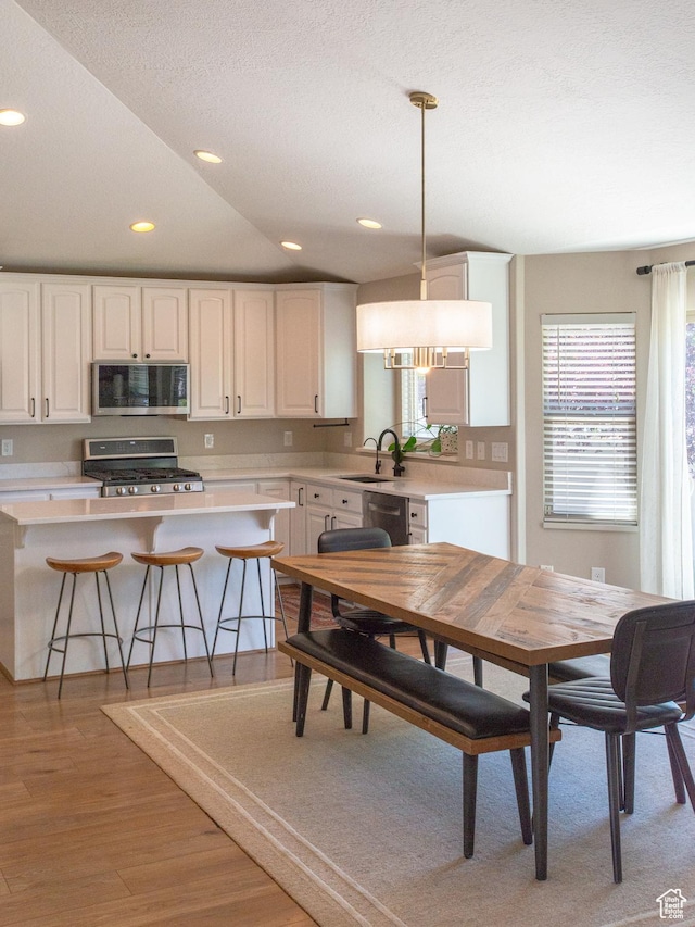 552 E Sunset Stream Way, Draper, UT 84020 - dining room with light wood-style floors, recessed lighting, and lofted ceiling