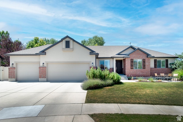 552 E Sunset Stream Way, Draper, UT 84020 - ranch-style house featuring driveway, a front yard, an attached garage, stucco siding, and brick siding
