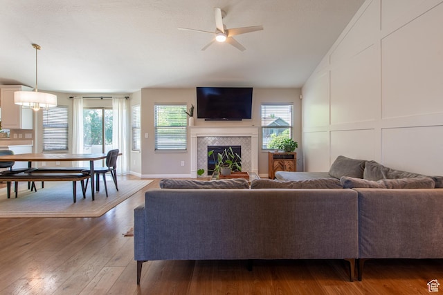 552 E Sunset Stream Way, Draper, UT 84020 - living room with ceiling fan, a tile fireplace, healthy amount of natural light, light wood-style flooring, and lofted ceiling