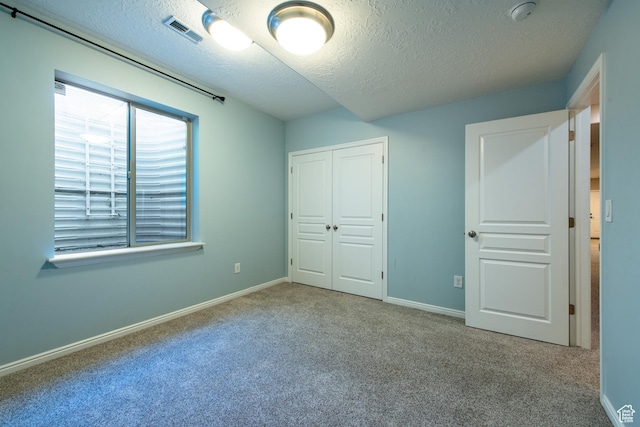552 E Sunset Stream Way, Draper, UT 84020 - unfurnished bedroom with carpet flooring, a textured ceiling, and a closet