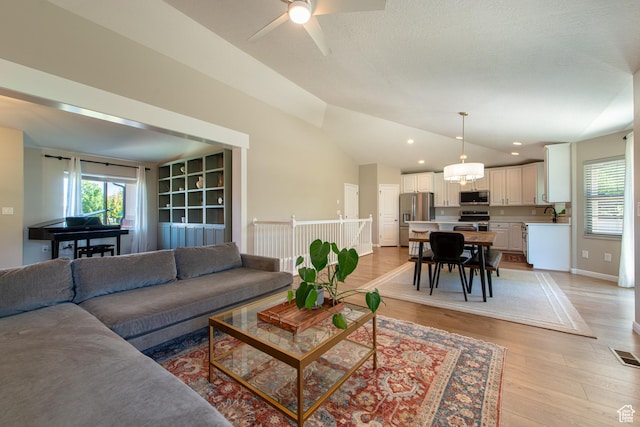 552 E Sunset Stream Way, Draper, UT 84020 - living area with healthy amount of natural light, vaulted ceiling, light wood-style floors, a ceiling fan, and recessed lighting