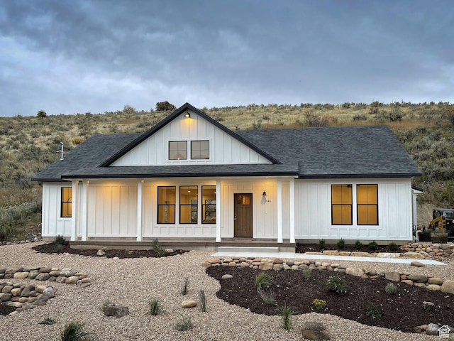 2640 W State Road 32, Peoa, UT 84061 - modern farmhouse with covered porch, a shingled roof, and board and batten siding