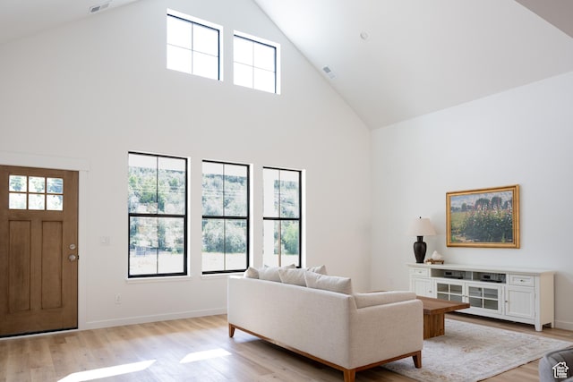 2640 W State Road 32, Peoa, UT 84061 - living area featuring high vaulted ceiling and light wood-style floors