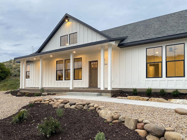 2640 W State Road 32, Peoa, UT 84061 - modern farmhouse with board and batten siding, a porch, and a shingled roof